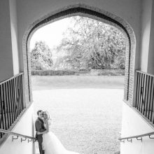 Farnham-Castle-wedding-photography-Nikki-Kirk-Photography-Hampshire-wedding-Cheltenham-Cotswolds-bride-and-groom-archway-staircase-gardens.jpg